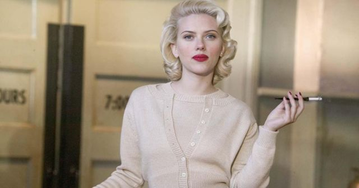 scarlett johansson with red lipstick holding a cigarette