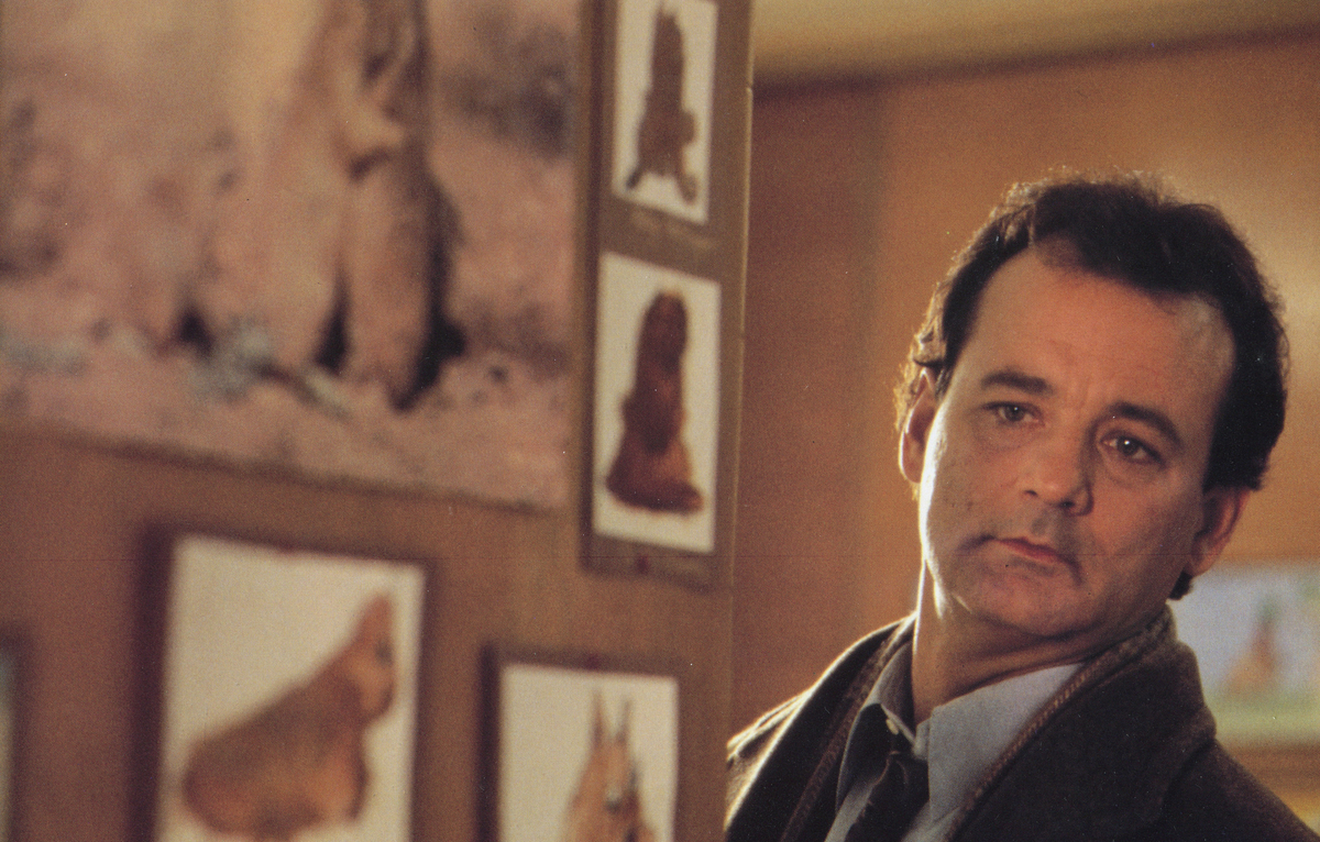 Bill Murray peering around a corner in Groundhog Day