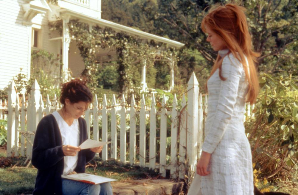 Sally (Sandra Bullock) and Gillian (Nicole Kidman) outside of their house in the movie Practical Magic
