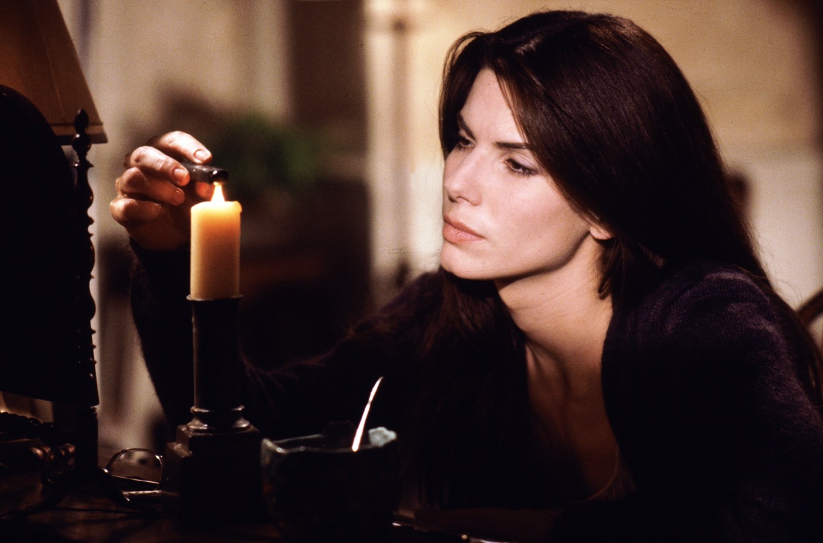 Sandra Bullock lighting a candle in the film Practical Magic