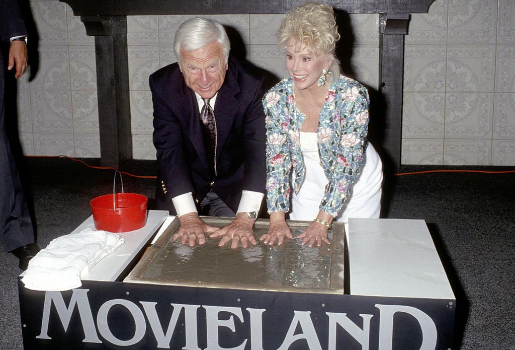 Albert and Gabor putting their hands in cement 