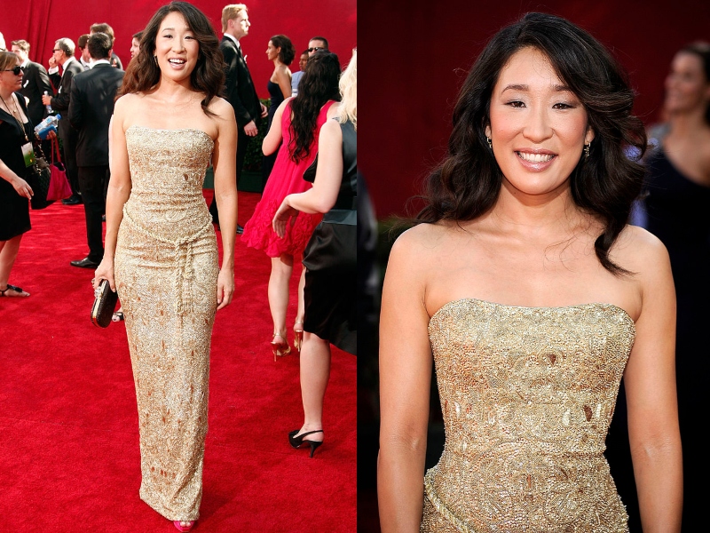 Sandra Oh wears a textured, form-fitting, soft gold gown.