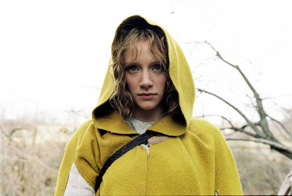 Woman in a yellow coat