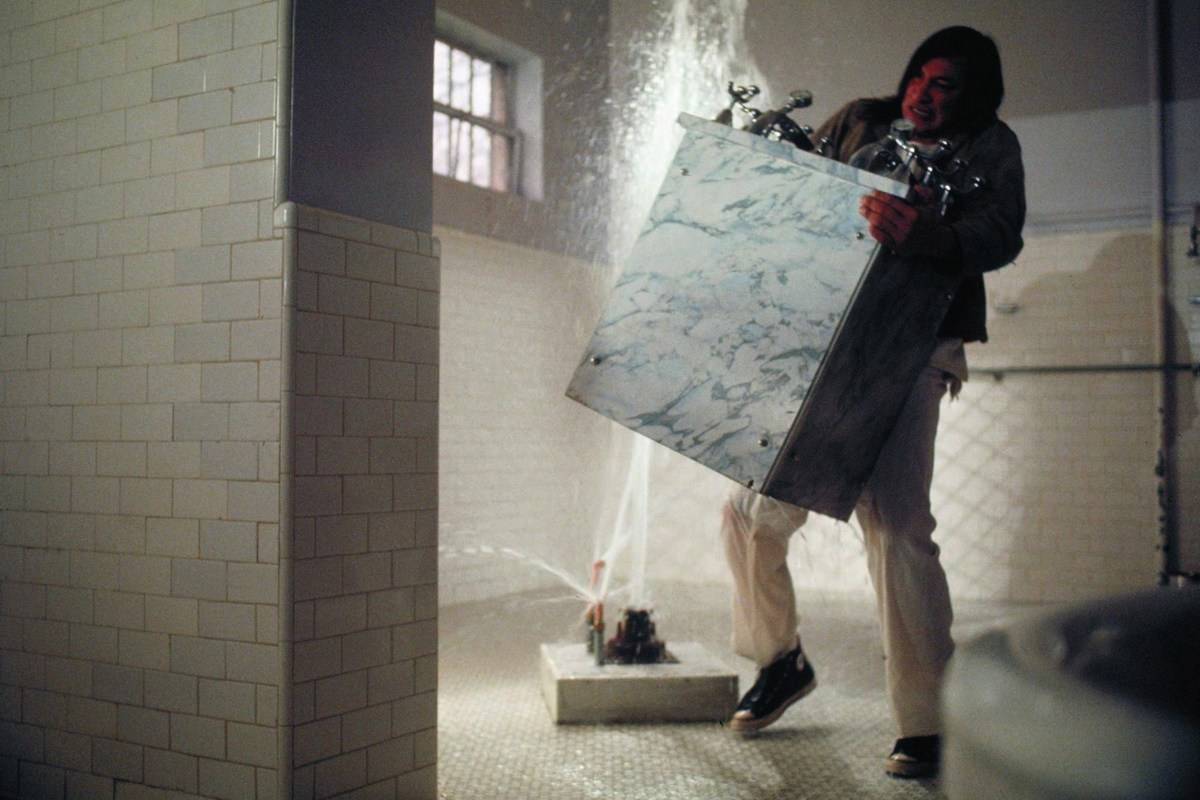 Man ripping out a sink