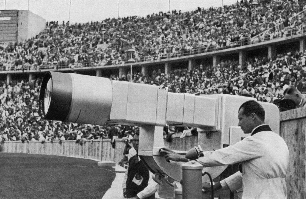 Man next to a camera