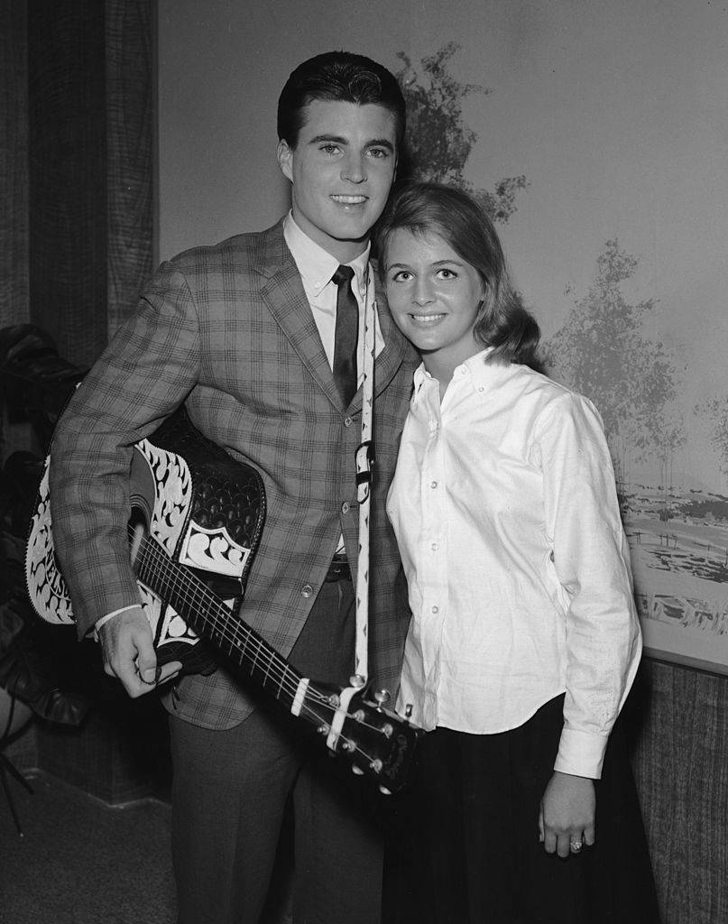American rock n' roll singer Rick Nelson (1940-1985) smiles with his wife Kristin Harmon.