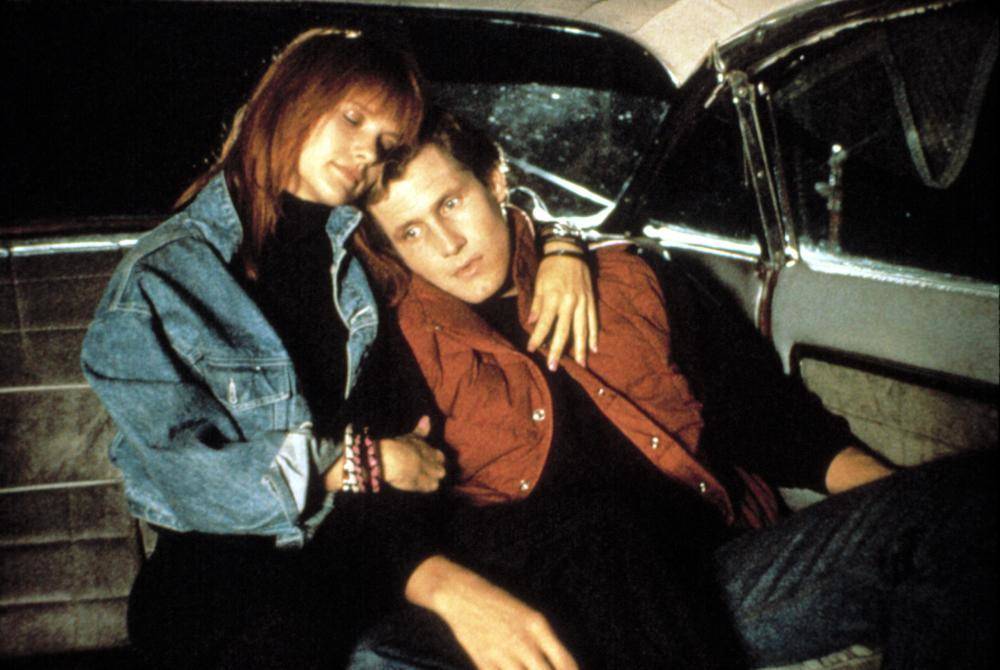 woman and man sitting in a car in return of the living dead part ii