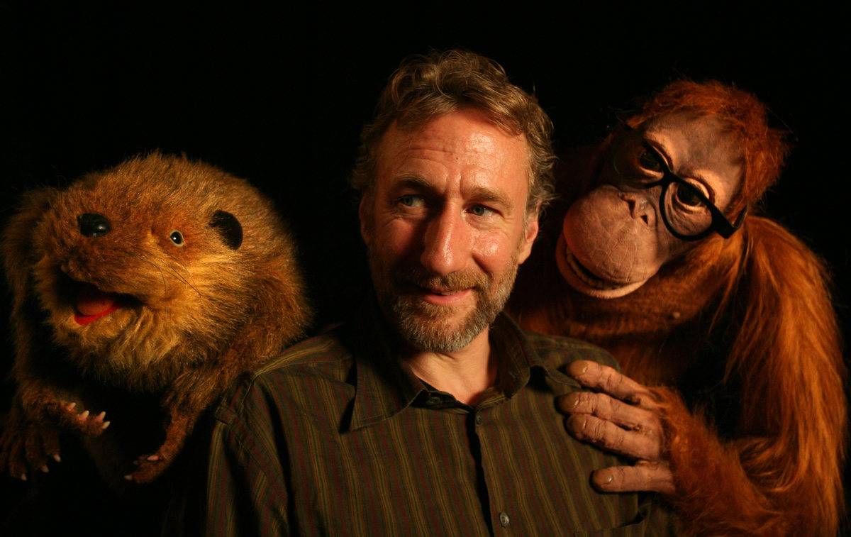 Brian Henson poses with a few of his puppets.