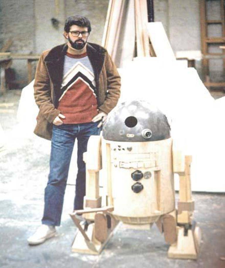 Behind-the-scenes photo of George Lucas and R2-D2 prototype