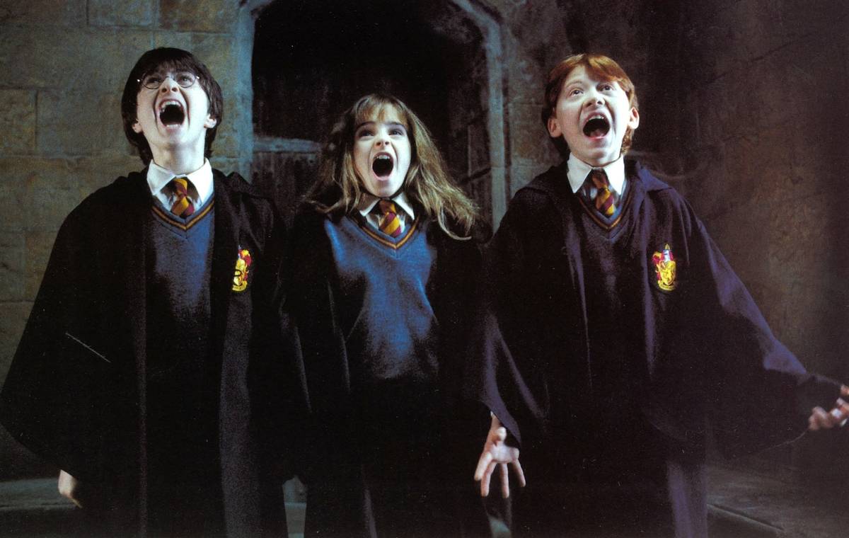 Daniel Radcliffe, Emma Watson, Rupert Grint in character for Harry Potter (2001)
