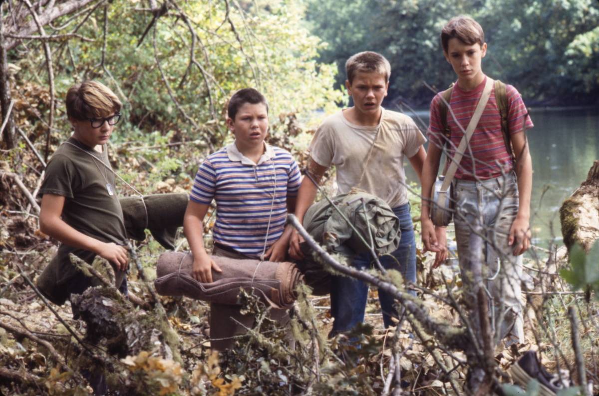 Boys from Stand By Me look shocked in woods