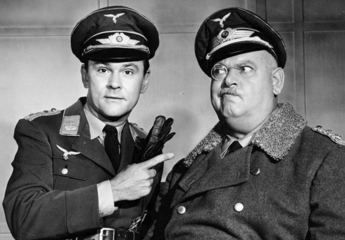 Cast members from Hogan's Heroes pose in promotional photo