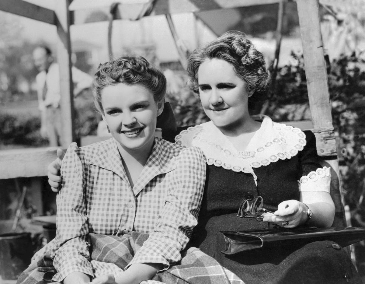 Judy Garland's mother visits the young star on the set of her new starring picture Little Nellie Kelly at Metro Goldwyn Mayer studios. The film is directed by Norman Taurog, and produced by Arthur Freed.