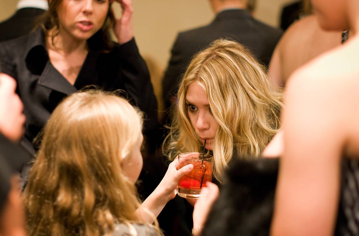 BOSTON - DECEMBER 10: Ashley Olsen, took a sip of Cait Freda's, 8, of West Roxbury, drink.