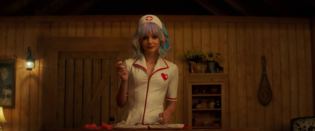 Carey Mulligan smirking in nurse outfit in Promising Young Woman