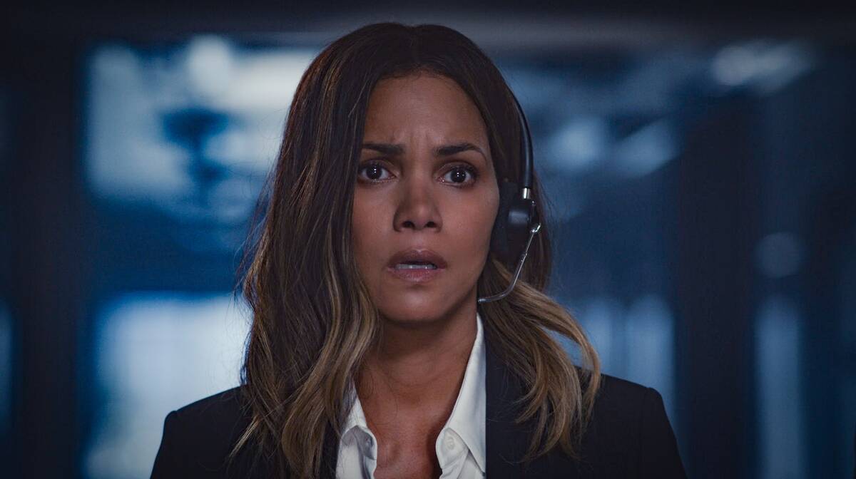 Halle Berry looking shocked in headset as Jo Fowler in Moonfall