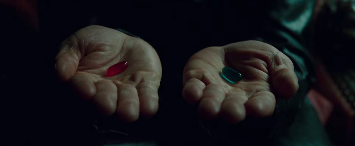 Lawrence Fishburne's hands holding pills in [redacted]