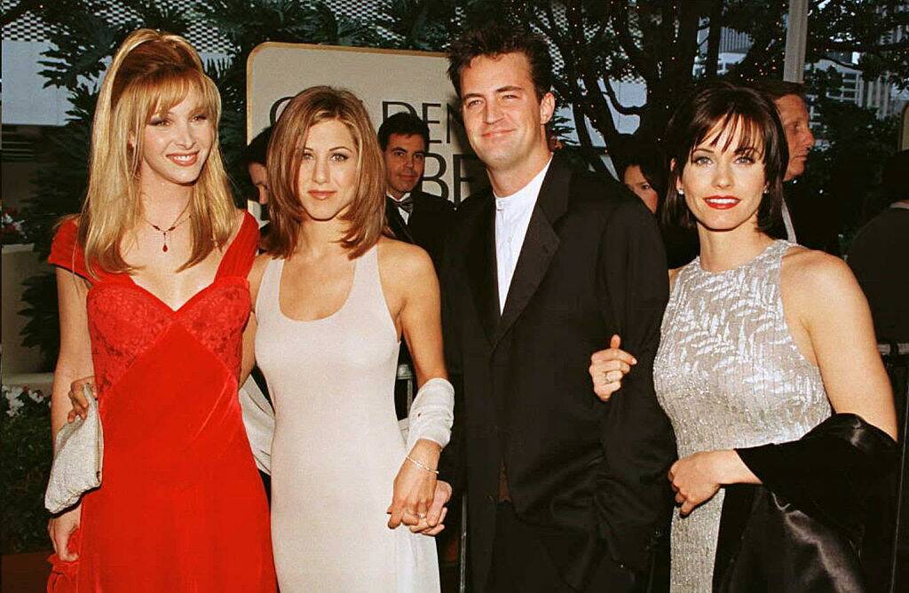 actors posing on the red carpet