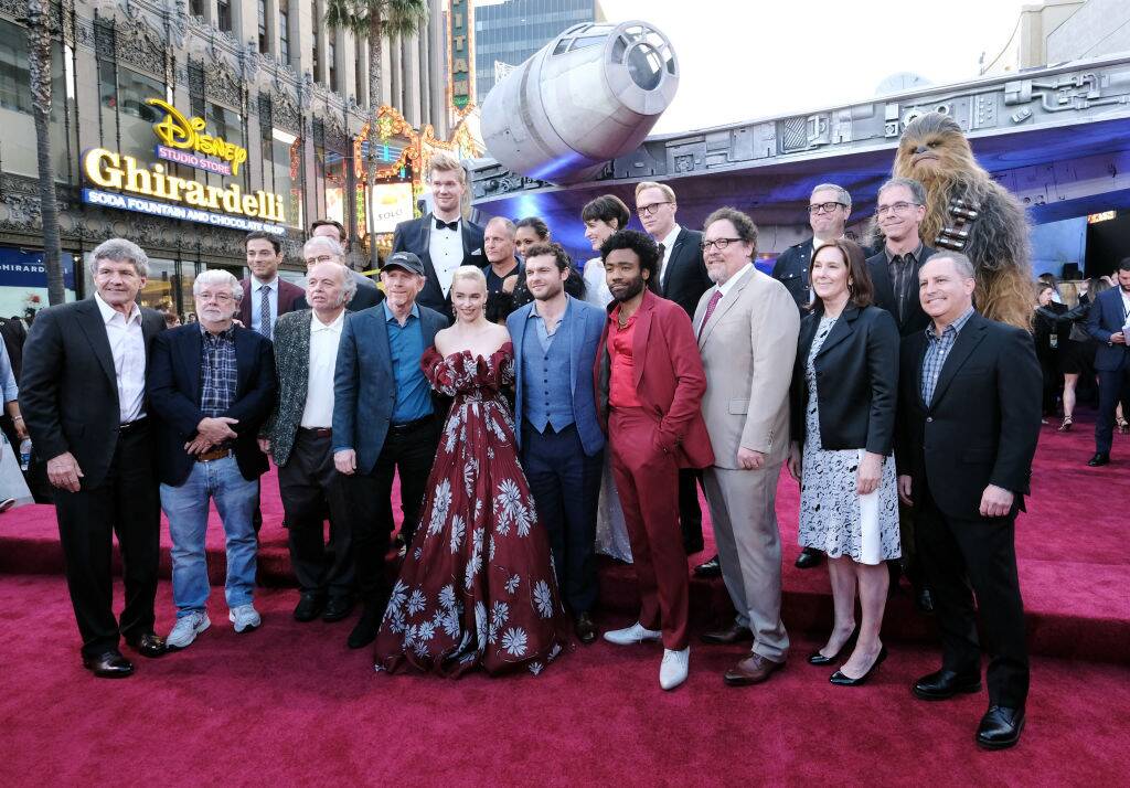 people posing on the red carpet