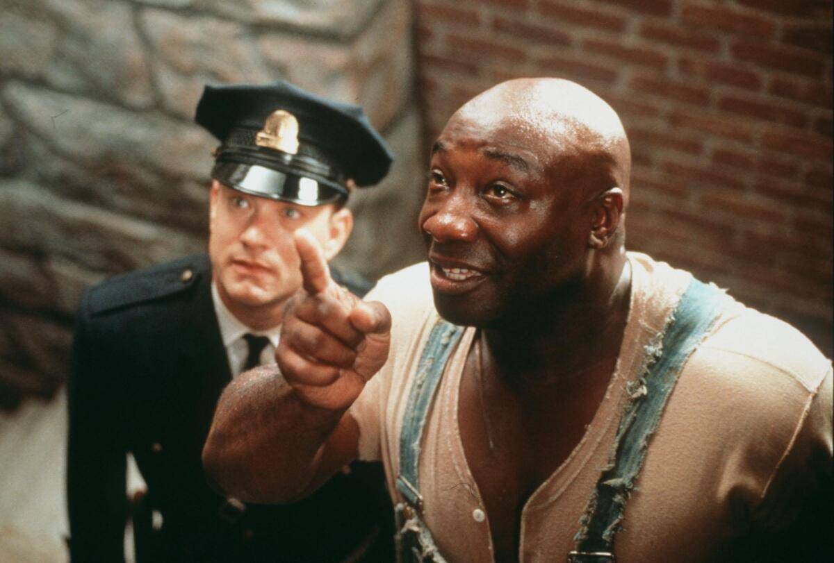 Michael Clarke Duncan points as John Coffey next to Tom Hanks as Paul Edgecomb in The Green Mile