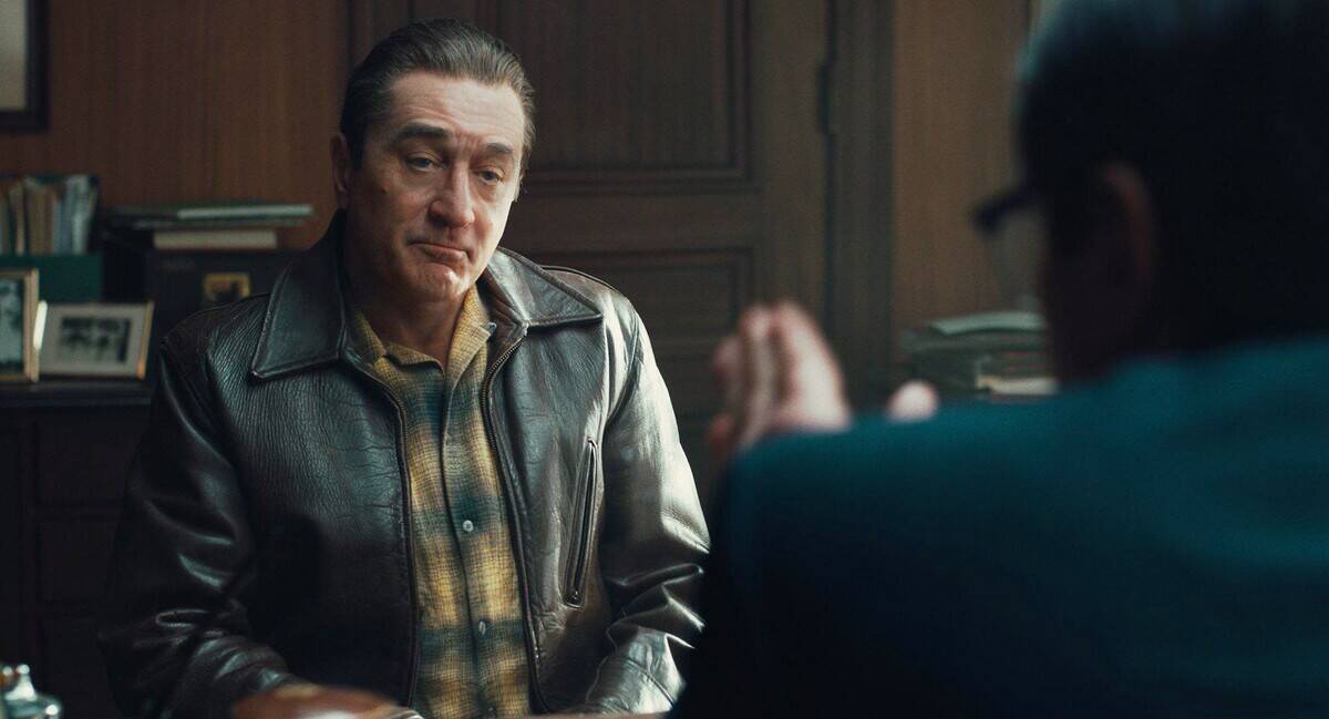 Robert Ne Niro sitting across from Ray Romano as frank Sheeran in The Irishman