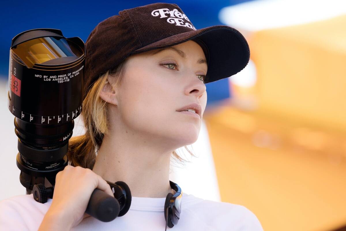 olivia wilde holding a camera