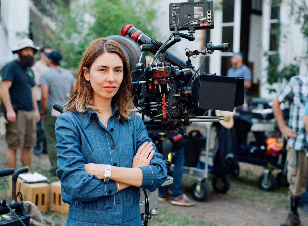 sofia coppola posing in front of a camera
