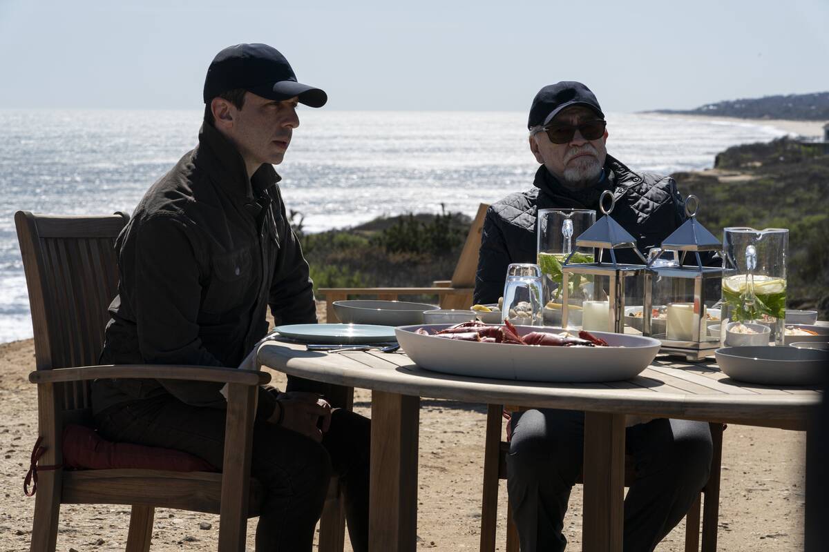 Jeremy Strong and Brian Cox sitting outside in Succession