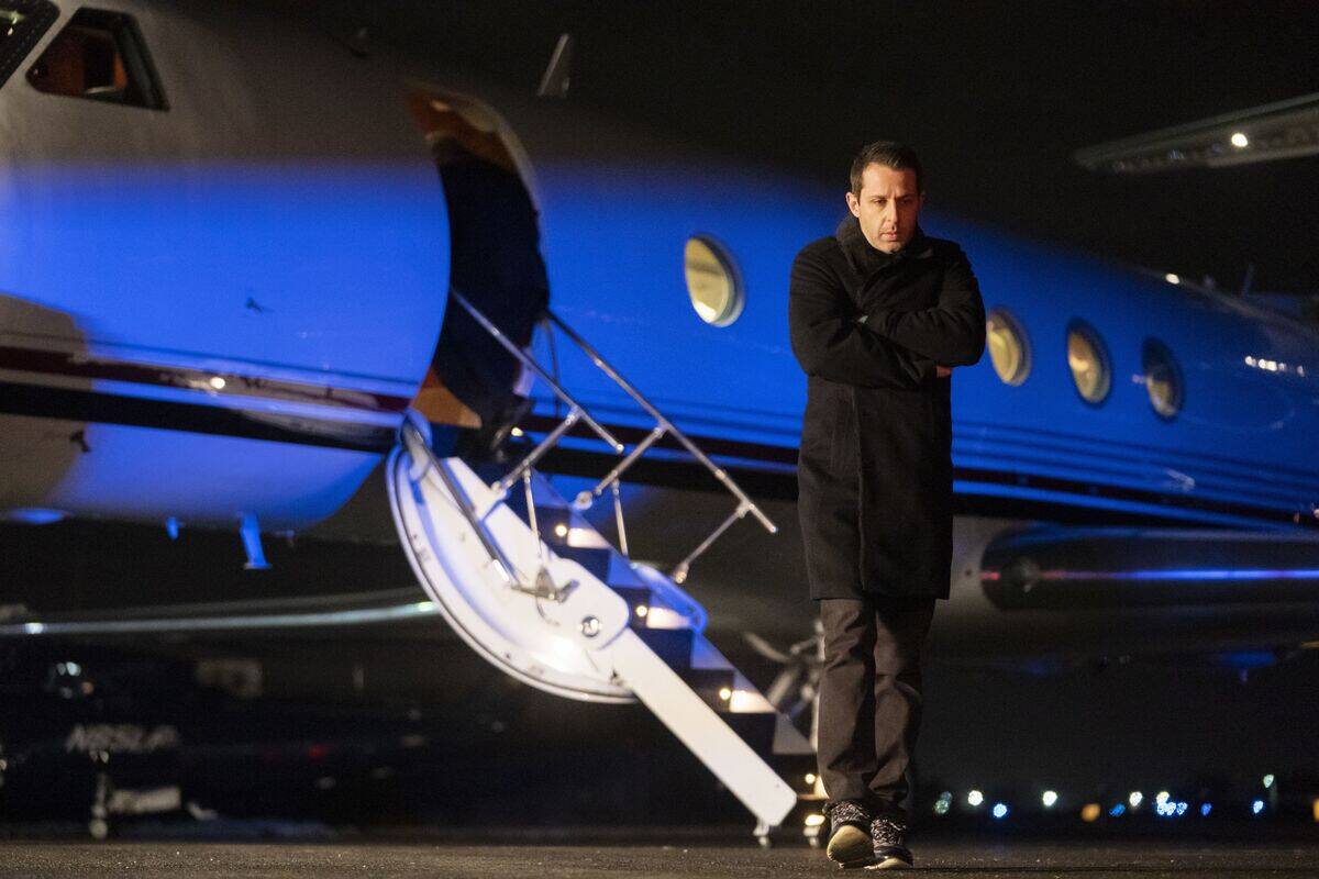 Jeremy Strong standing outside plane as Kendall Roy in Succession