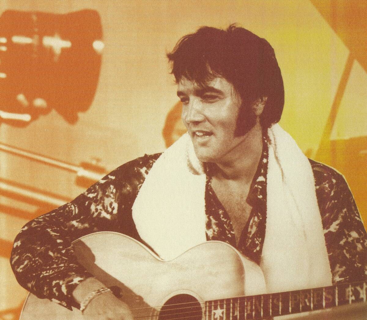 elvis presley playing guitar